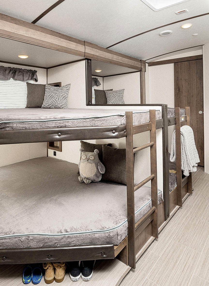 Side view of four bunks in Passport trailer