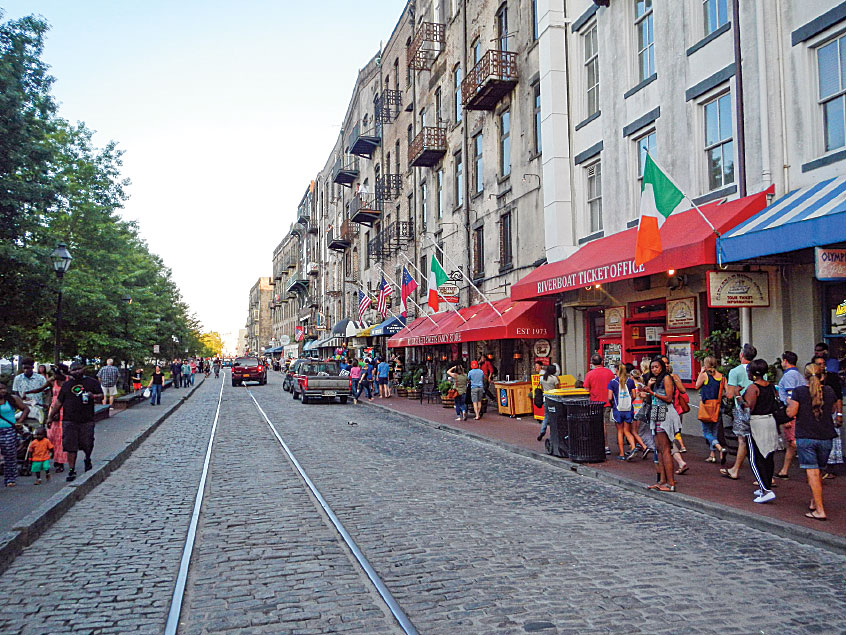 Shops and restaurants line Savannah’s cobbled River Street. 