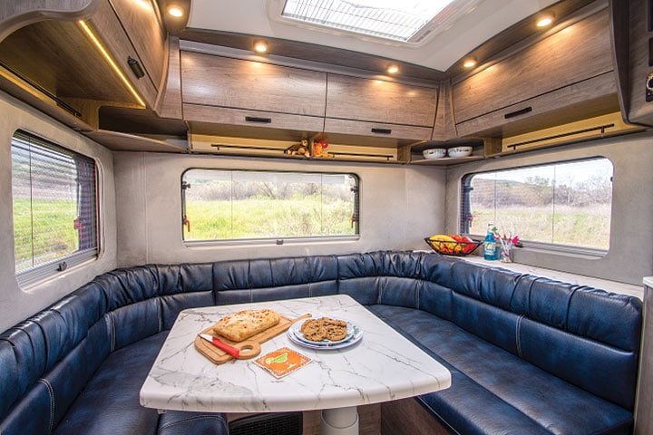 U-shaped dinette with denim-looking leatherette cushions in Lance 2075 travel trailer