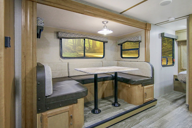 The Winnebago Minnie 2455BHS features a U-shaped dinette