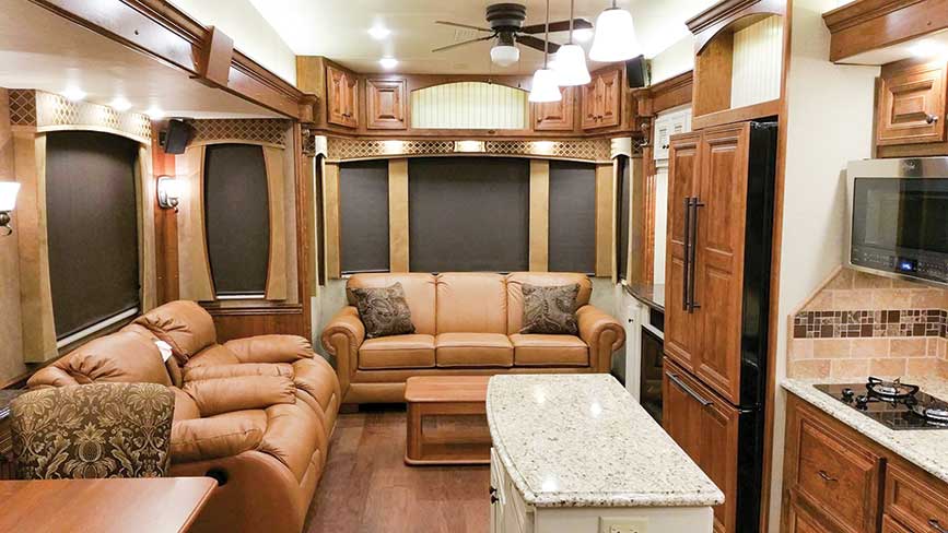 Beautiful living area with leather couches inside RV