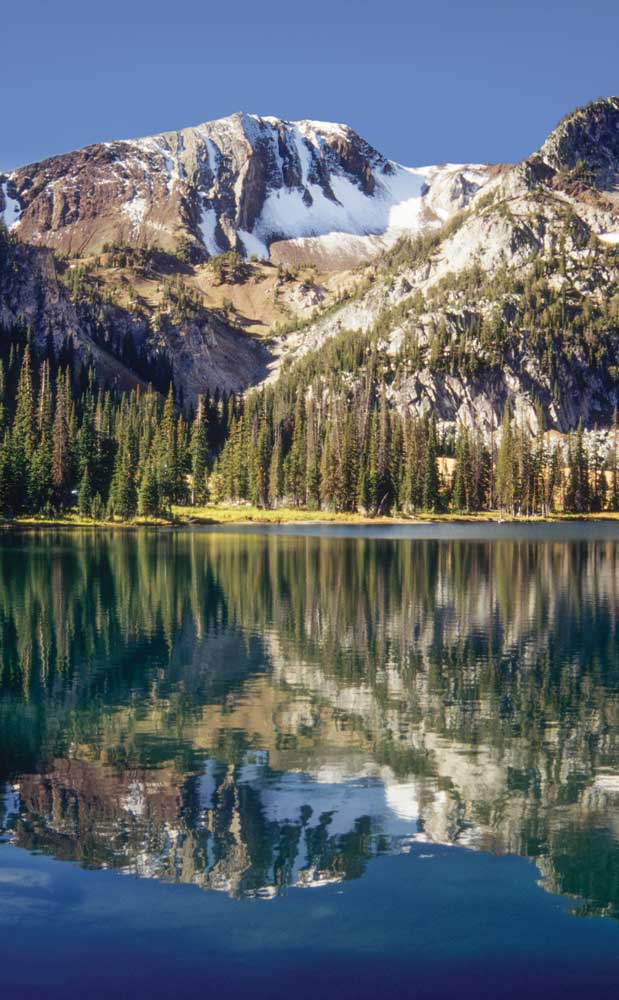 Aneroid lake is about 6 miles from the East Fork Wallowa River Trailhead. Petes Point looms above the crystal waters, which offer good trout fishing in the summer.