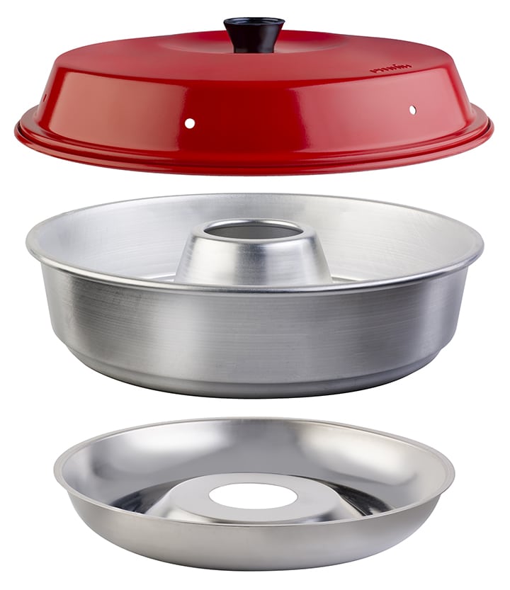 Three pieces of the Omnia oven with a red lid and silver base and center