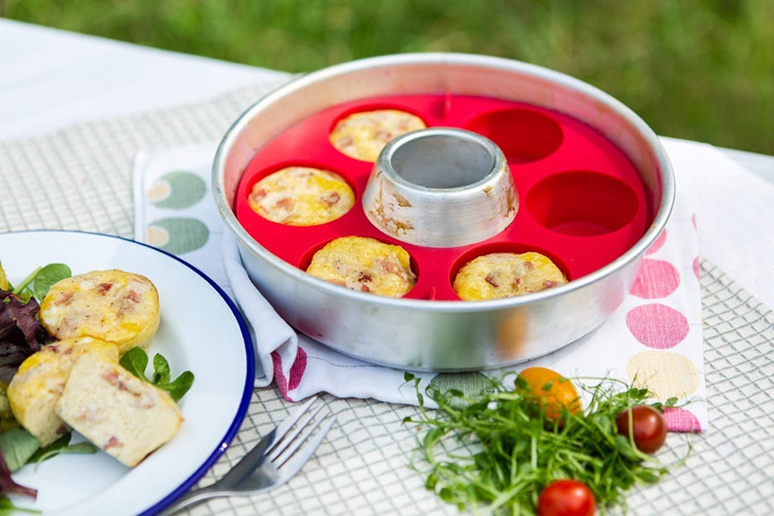 Omnia Muffin Ring with muffins inside on picnic table