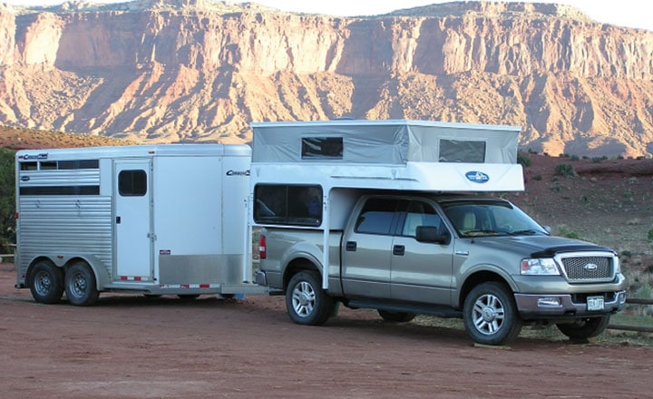 Phoenix pop-up camper on truck and towing horse trailer