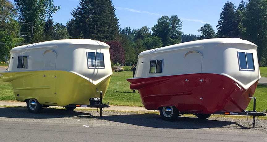 A white and yellow and a white an red Relic trailer.