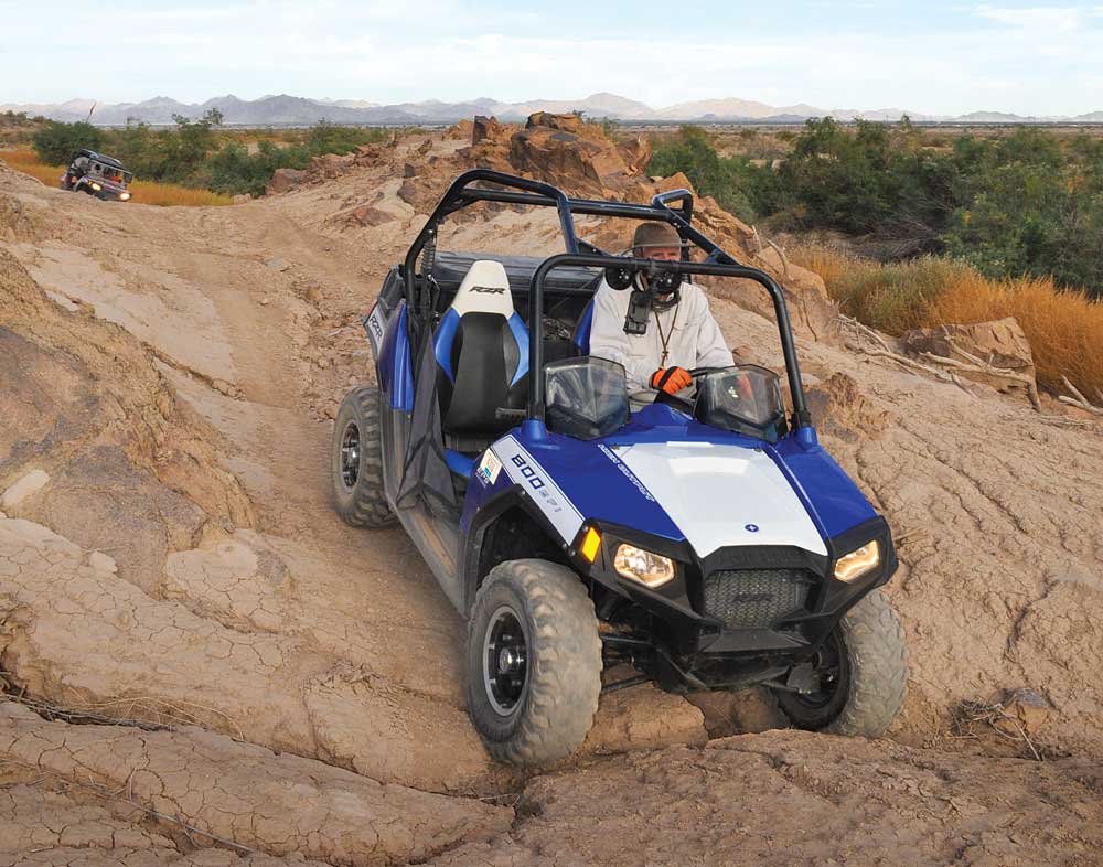 Ted Werner traverses rough desert routes in his Polaris Ranger.