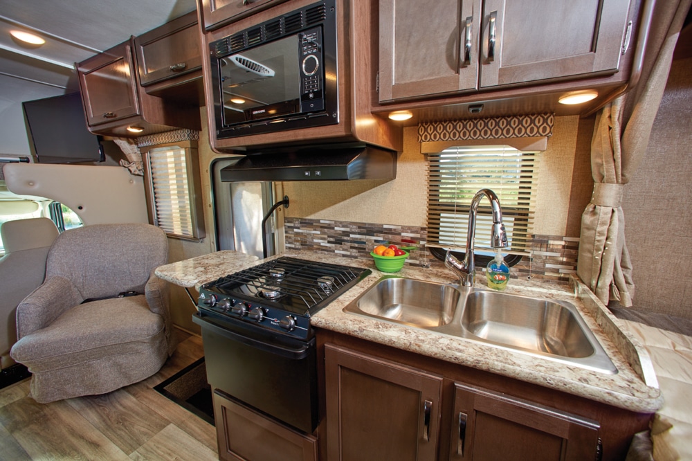 The efficient kitchen has a microwave and oven, plus continuous grates over the three-burner range. We appreciated the counter extension to the left of the range, and also the great interior lighting. 