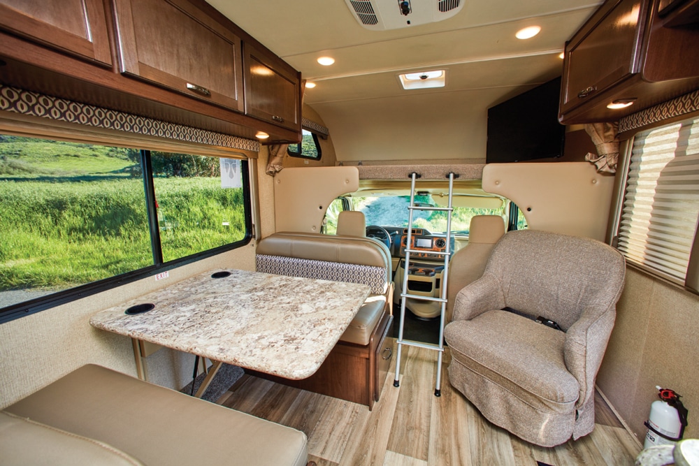 An inviting living area seats five comfortably and the sliding window over the dinette allows for good airflow. A 40-inch TV is housed at the foot of the cabover bunk and swivels out for viewing. 