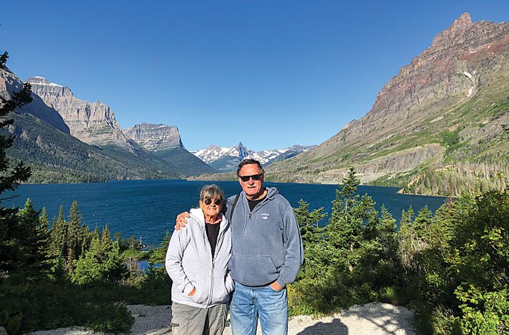 Authors Jan and Tom Dougherty with Saint Mary Lake in Glacier National Park