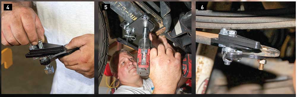 4) The StableLoad Quick Disconnect stabilizers are assembled with three wedges to fit the gap between the lower overload spring and the main leaf springs. 5) A 7/16-inch bolt secures the wedge pack to the overload spring. The bolt is torqued to 35 lb-ft. 6) The wedge pack is set in the disengaged position.