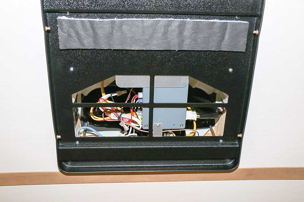 Photo shows the WackO intake housing base attached to the A/C unit with the included hardware.
