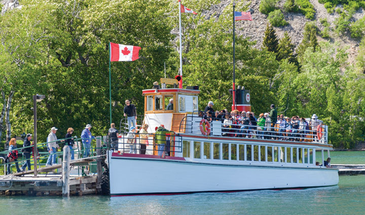 Waterton Shoreline Cruise ship at dock between Alberta, Canada, and Montana