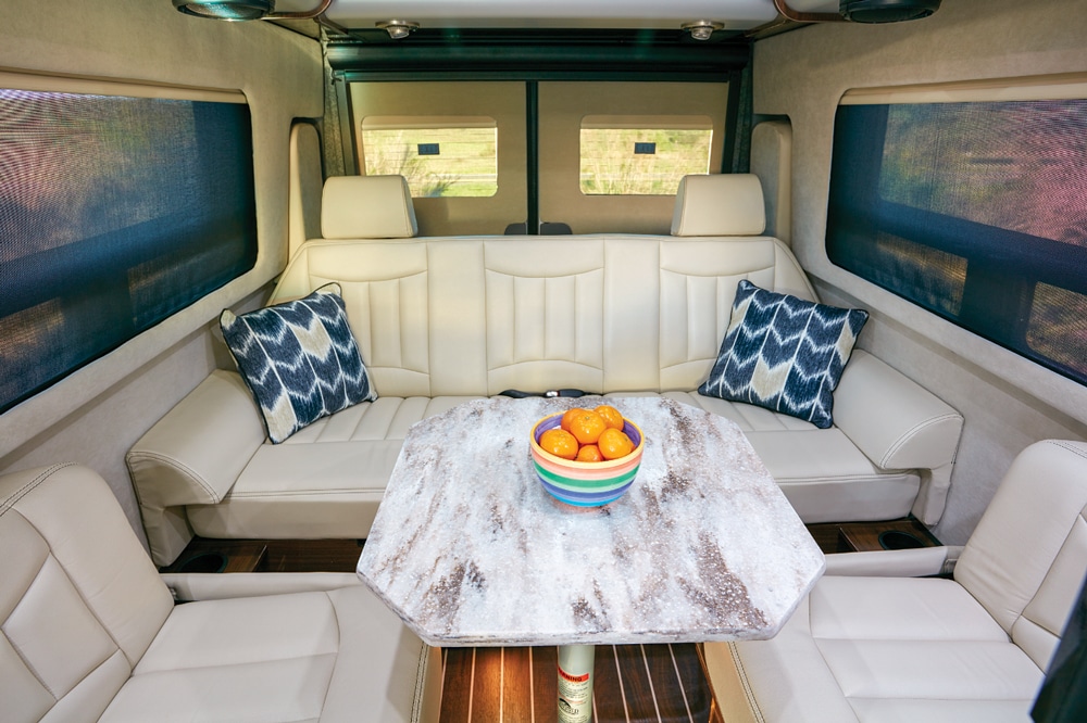 The Ultraleather sofa and dinette at the rear of the Grand Tour can seat five in comfort and converts into a 70-by-82-inch bed. Marine-industry Majic Suede fabric window surrounds are soft to the touch and wipe clean easily. Day-night shades are remote-controlled and part of the motorhome’s high-end dÃ©cor. 
