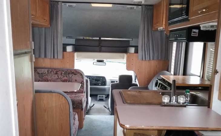 Bev Cameron's Hilander 25 interior is vintage 1990s, with a soft blue/gray color scheme.