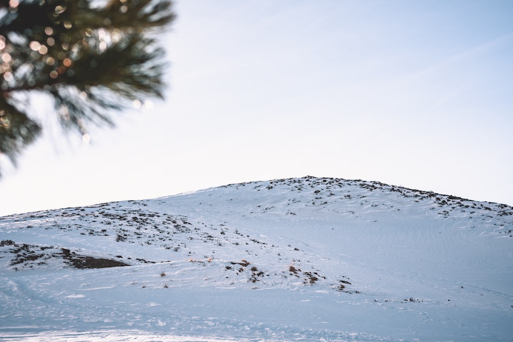 a snowy hill that someone could snowshoe up