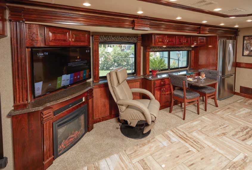 Freestanding Euro chair, placed here between the galley’s entertainment center and electric fireplace and the table-for-two dinette, adds seating versatility.