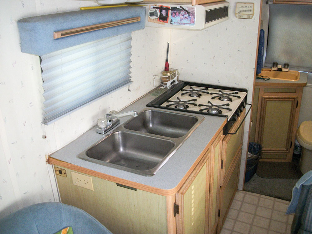 With a double sink and four-burner stove, the Micro Warrior’s galley is compact and usable. 