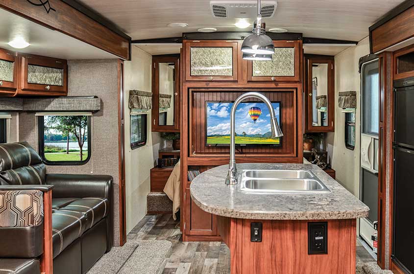 Heartland Wilderness RV living area with kitchen island and couch