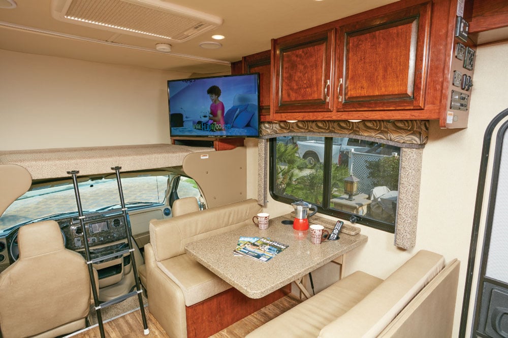 Good lighting, an open feel and a jackknife sofa (not shown) across from the four-seat dinette with Soft Touch vinyl cushions are conducive to lounging.