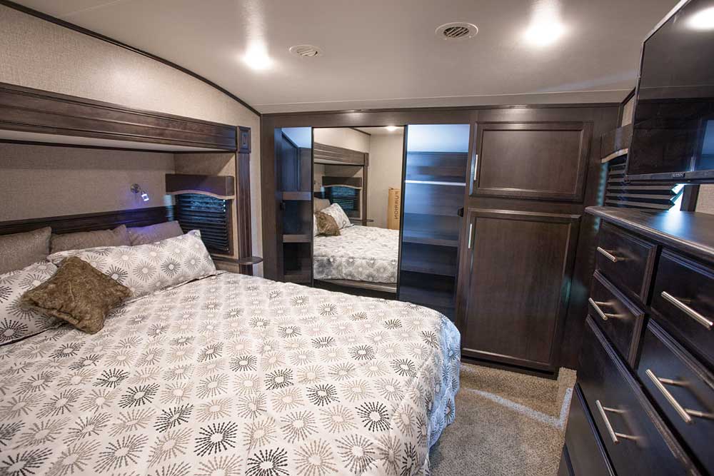Surprisingly roomy spaces in the Eagle 321RSTS include a well-laid-out mirrored-door bedroom closet