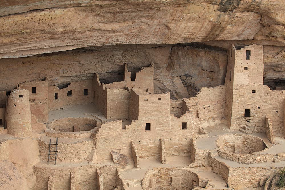 The largest cliff dwelling in North America, Mesa Verde’s Cliff Palace is housed in an alcove about 215 feet wide, 90 feet deep and 60 feet high. It was home to an estimated 100-120 people. Above the cliff overhang, on the surface of the mesa, is a red soil called loess. Spring windstorms bring this fertile soil from northeastern Arizona providing an environment that can support plants, including four types of wildflowers found nowhere else in the world. Mesa Verde means “green table.”