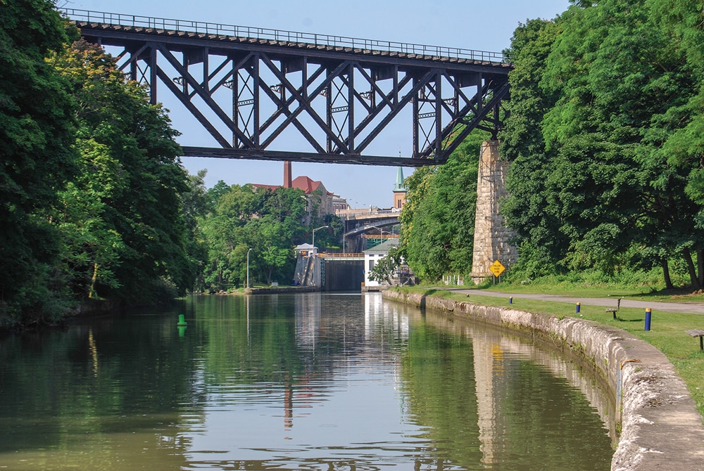 The towpath along the Erie Canal at Lockport, New York, once trod by barge-pulling mules, now offers visitors a shady spot for a stroll.