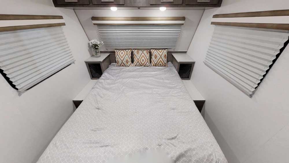 Up front, the 60-by-80-inch queen bed lifts to provide access to basement storage.