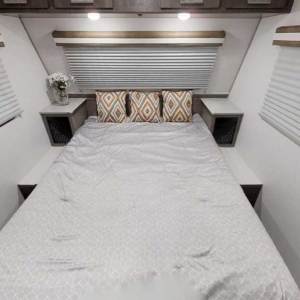 Up front, the 60-by-80-inch queen bed lifts to provide access to basement storage.
