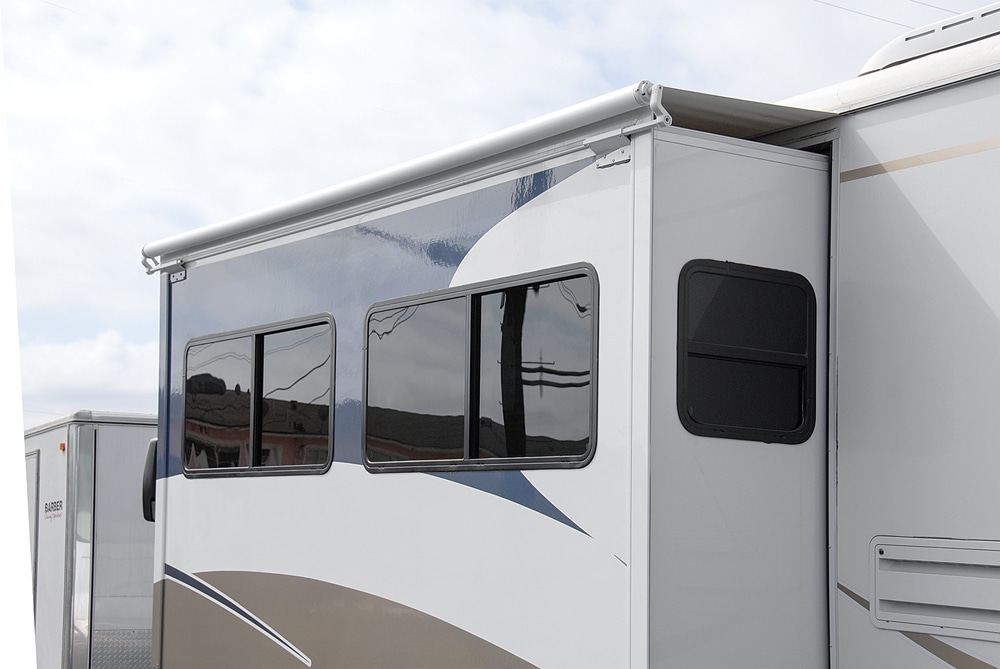 Slide topper prtects an RV slideout room