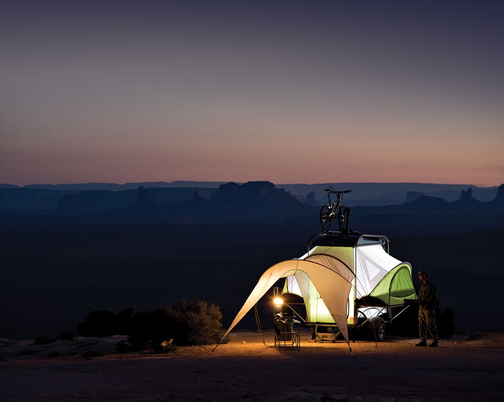 The SylvanSport Go trailer takes tent camping to new heights, combining a canvas-type dome enclosure with the off-the-ground convenience of a traditional RV. The material extends beyond the trailer for a great covered-patio effect.