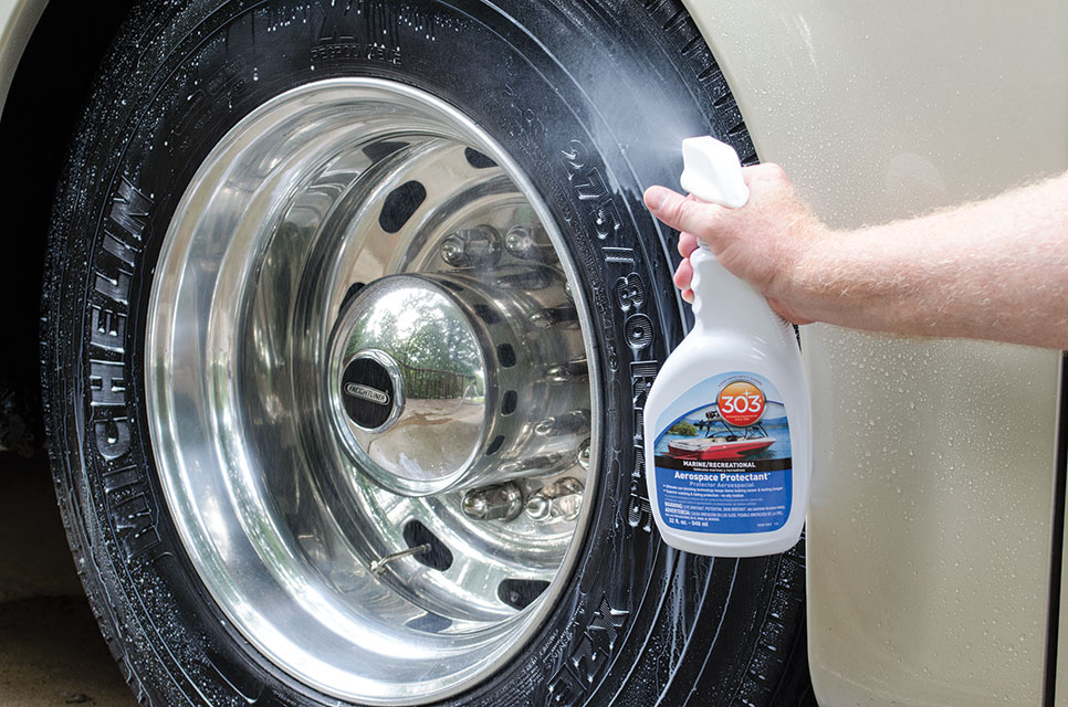 Man spraying Aerospace Protectant on RV tire