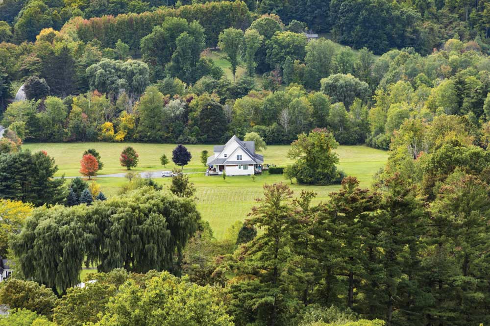 A Victorian- style farmhouse epitomizes the charm and simplicity of rural Vermont.
