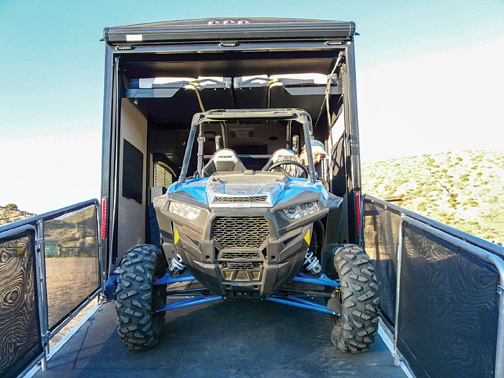 Measuring 10 feel long, the two-seat Polaris RZR XP Turbo (right) nested perfectly inside the Weekend Warrior 28W, even leaving room for two dirt bikes.