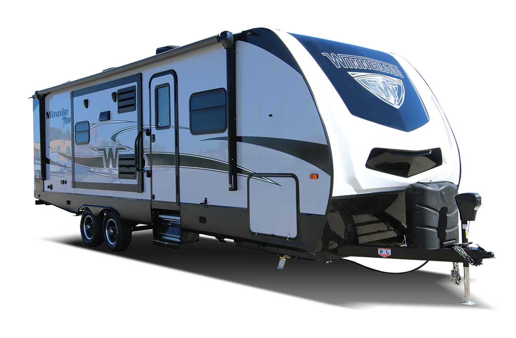 White and blue designed Winnebago travel trailer