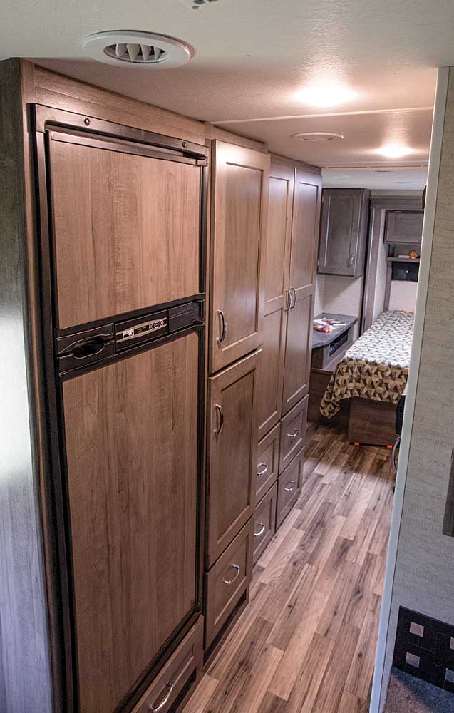 Chill and fill: The hallway leading back to the bedroom from the living area features a 7.5-cubic-foot refrigerator that blends in nicely alongside the pantry, a large wardrobe and drawers for lots of packing space.