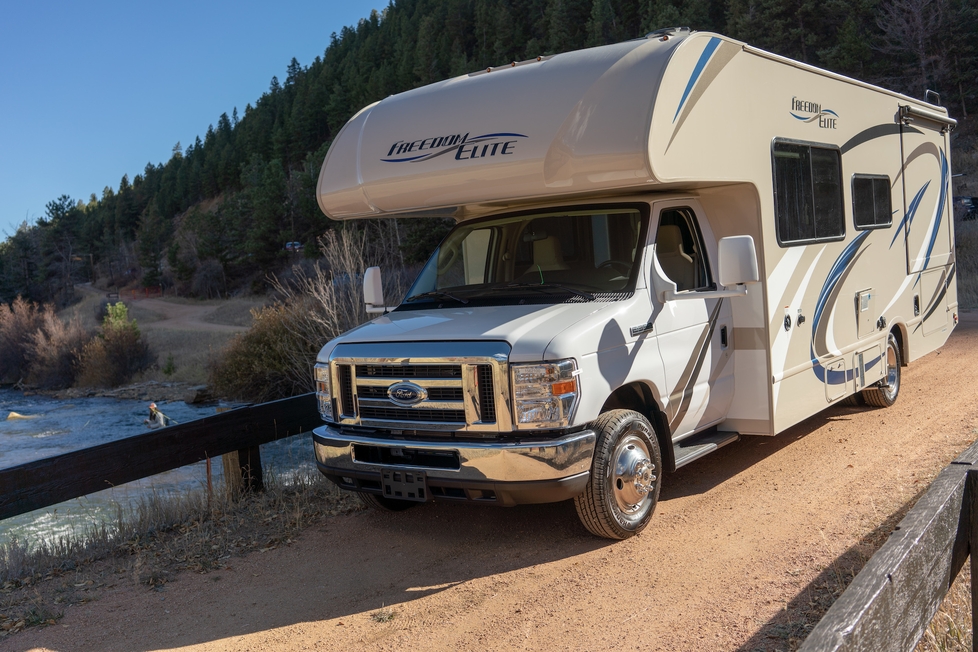 Class C RV stopped on the road.