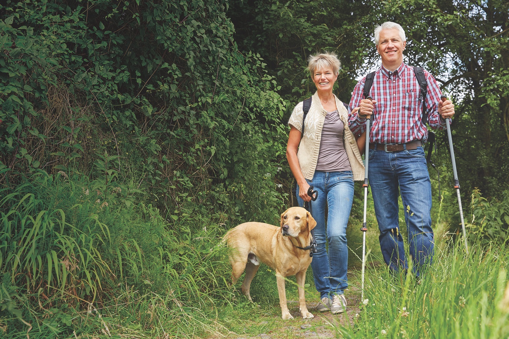 hiking-couple-with-dog-AdobeStoc