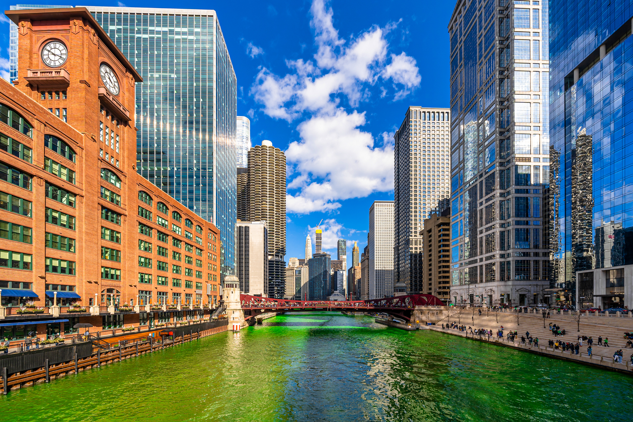 Chicago building and cityscape on Saint Patrick's day around Chicago river walk with green color dyeing river in Chicago Downtown, illinois, USA, crowned irish and american people are celebrating.Chicago building and cityscape on Saint Patrick's day around Chicago river walk with green color dyeing river in Chicago Downtown, illinois, USA