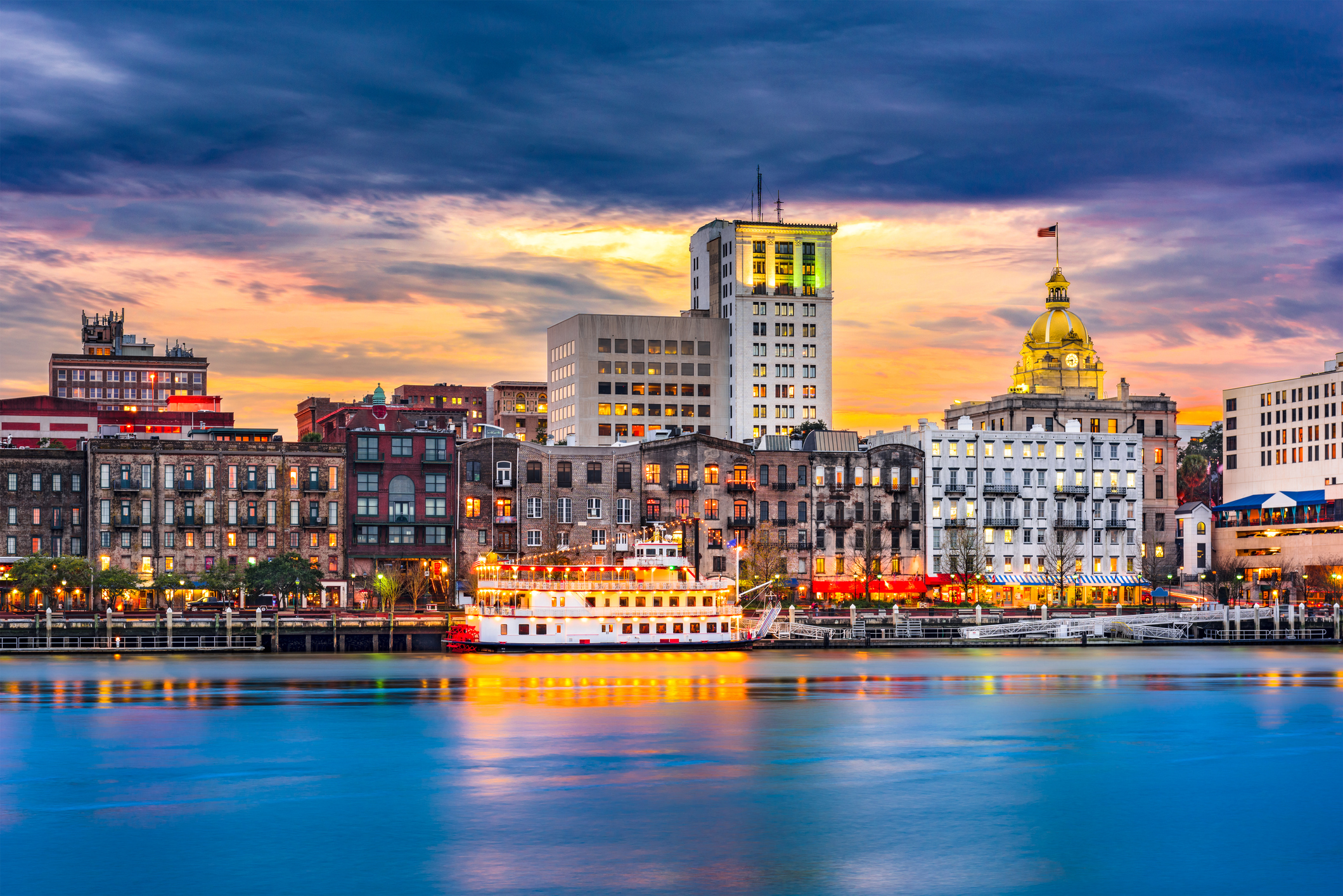 Savannah, Georgia, USA skyline on the Savannah River at dusk.