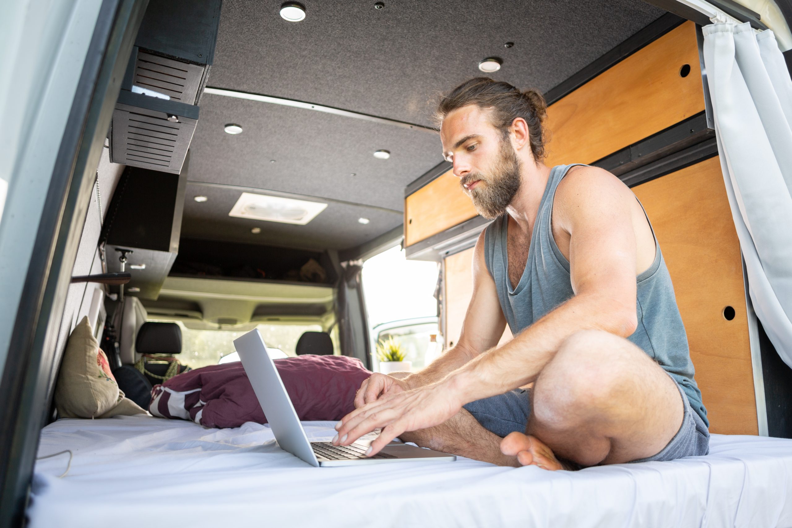 Man in Camper Laptop Work Remote