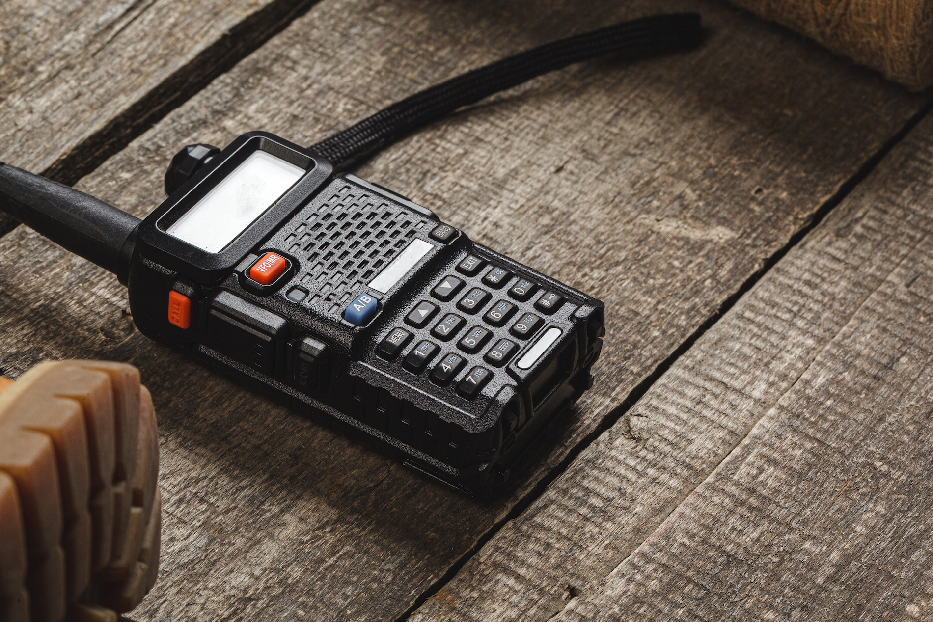 Walkie talkie radio set on wooden table close up