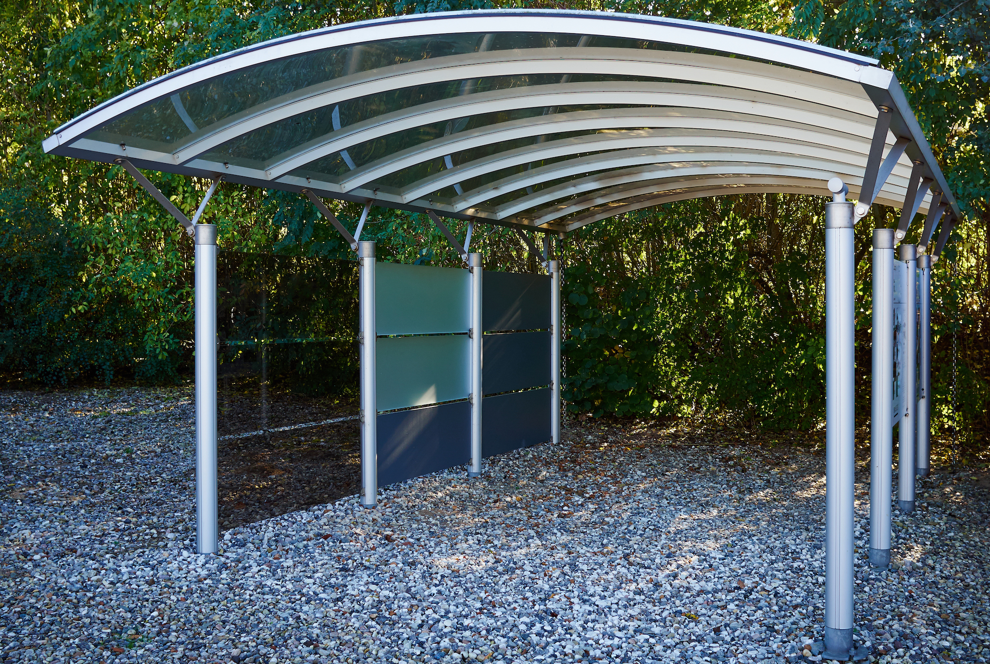 Modern metal carport car garage parking made of silver metal and glass