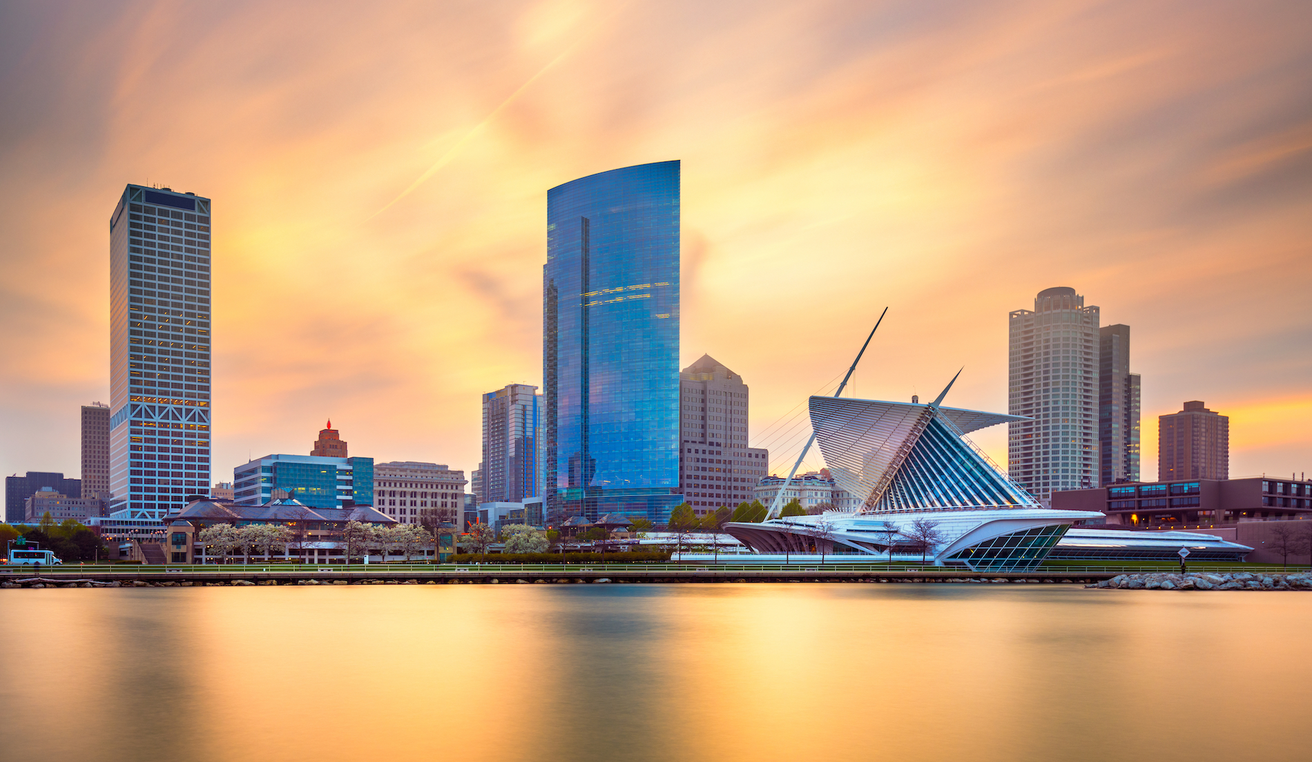 Milwaukee, Wisconsin, USA downtown city skyline on Lake Michigan at twilight.