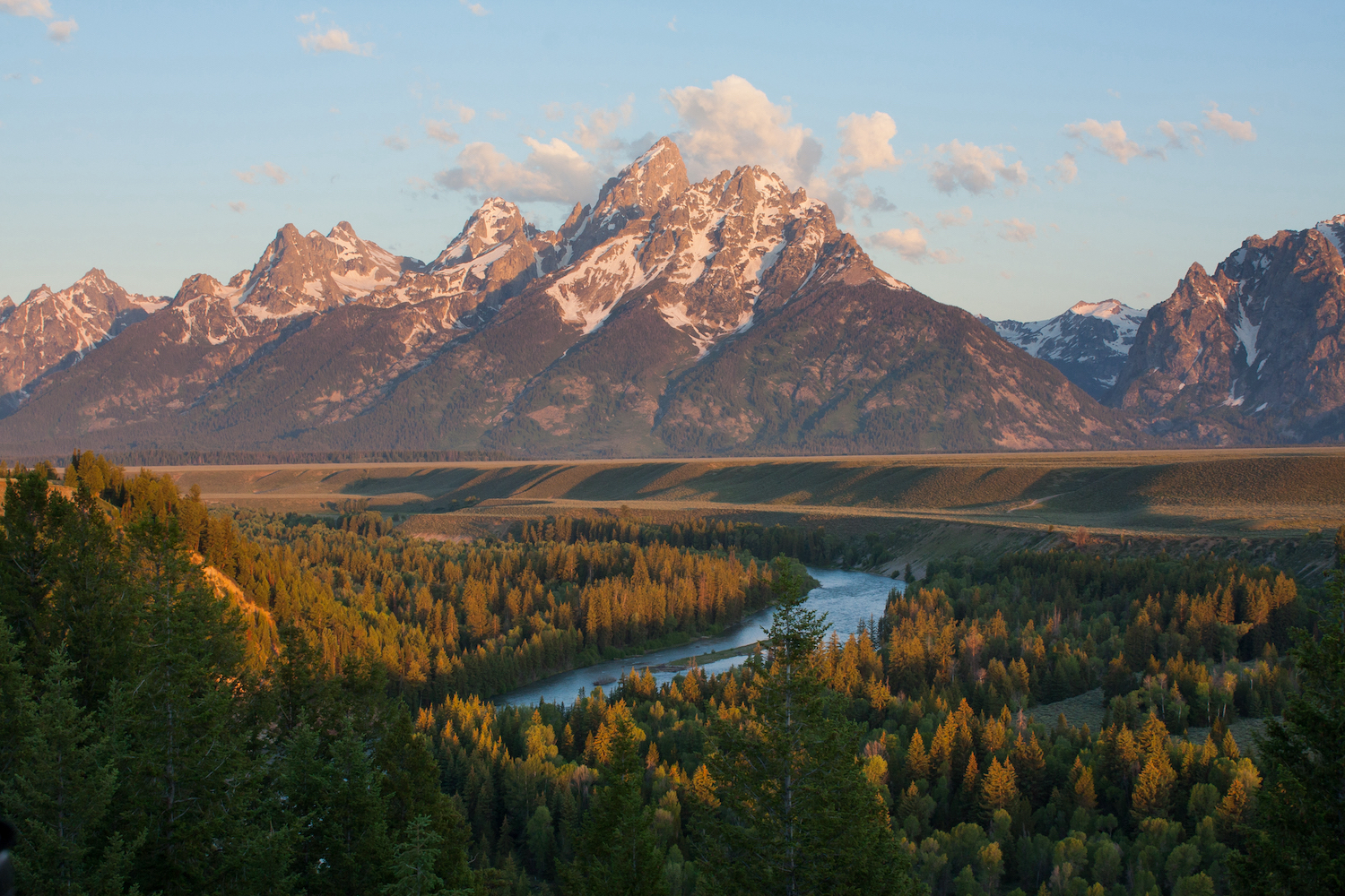 Grand Tetons peak at sunrise with snake river overlook in Wyoming, US