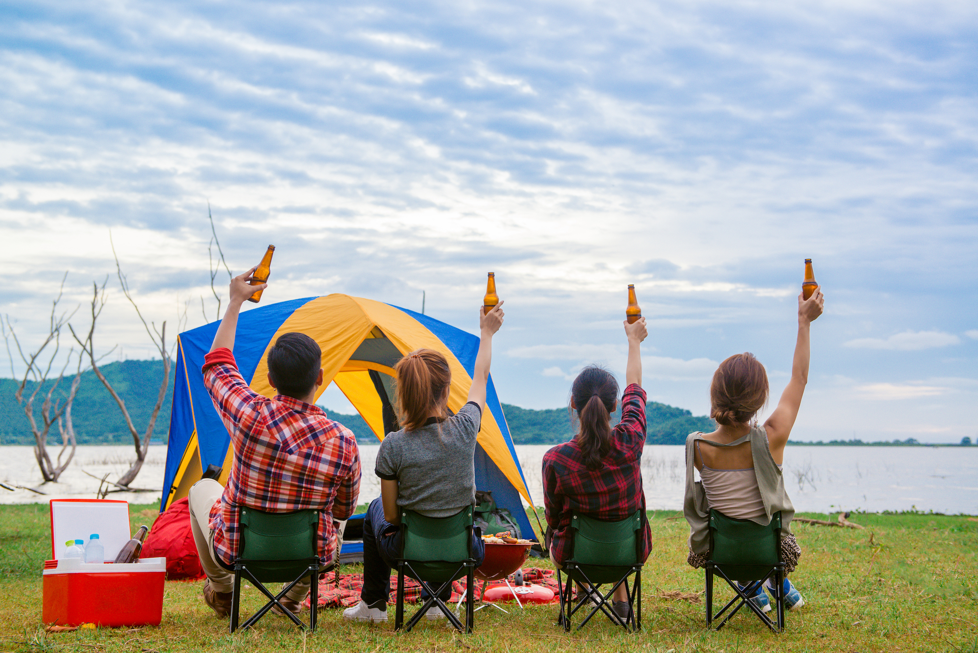 Campers toasting beers at campstie