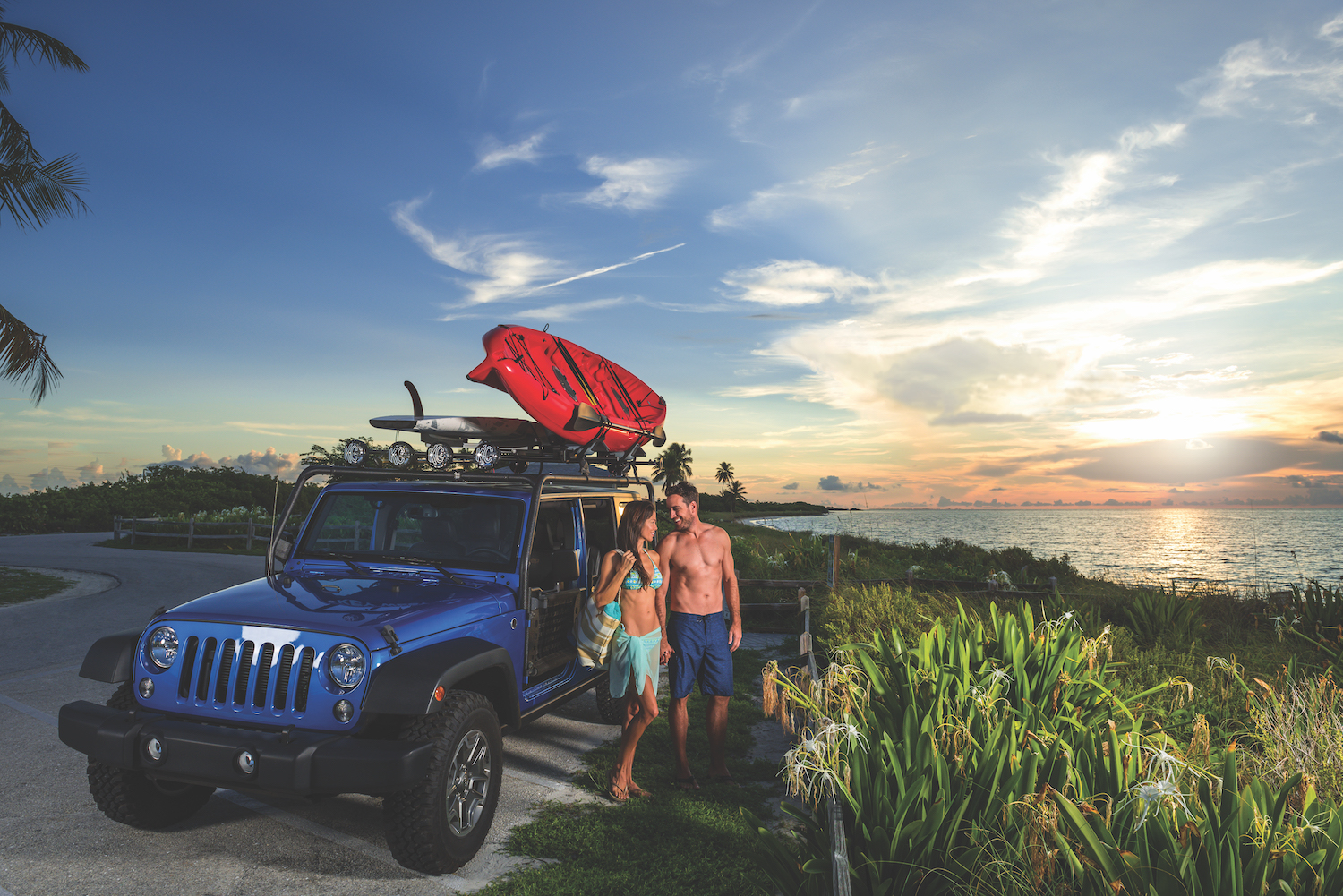 Couple with a jeep and a kayak