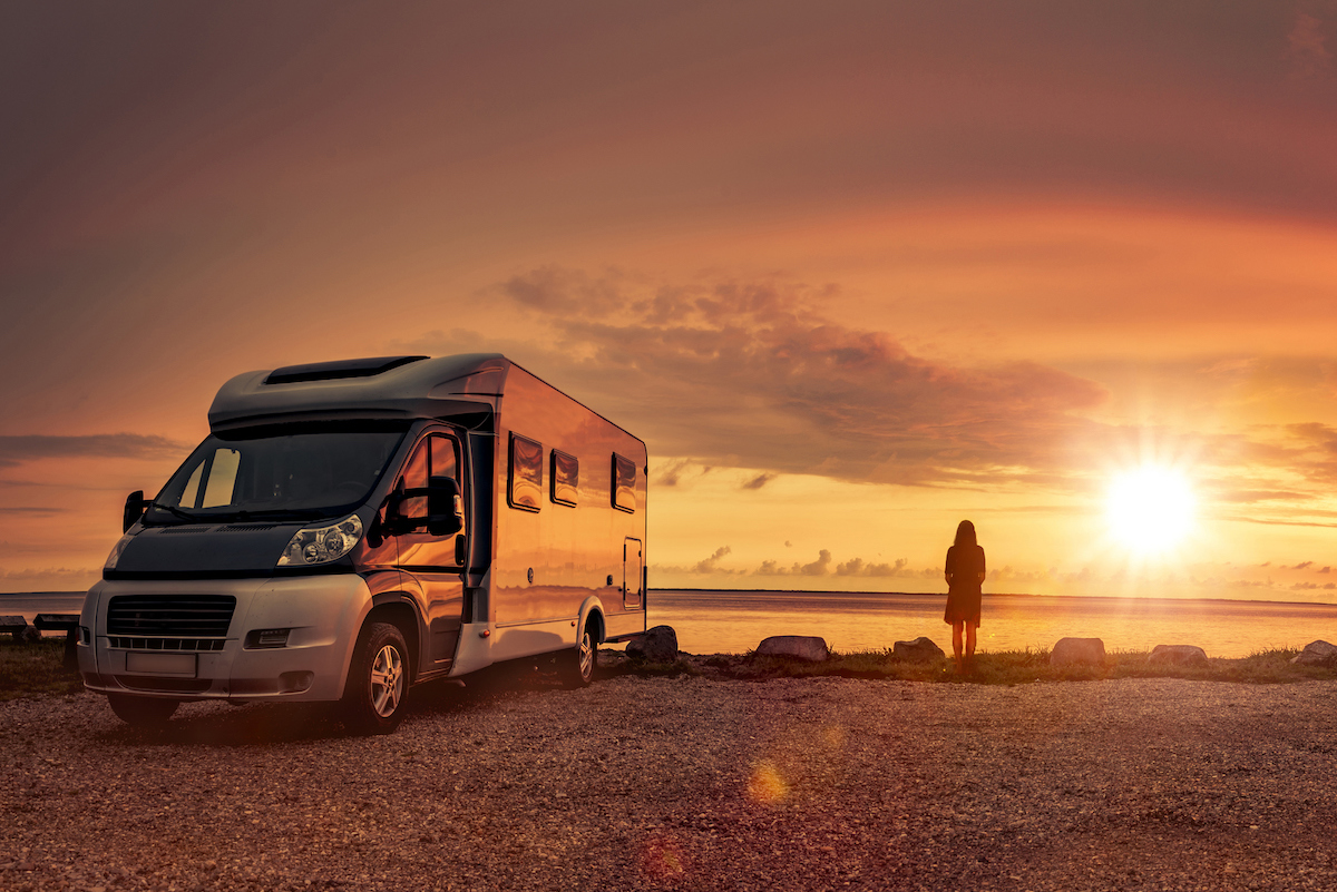 RV parked at the beach at sunset