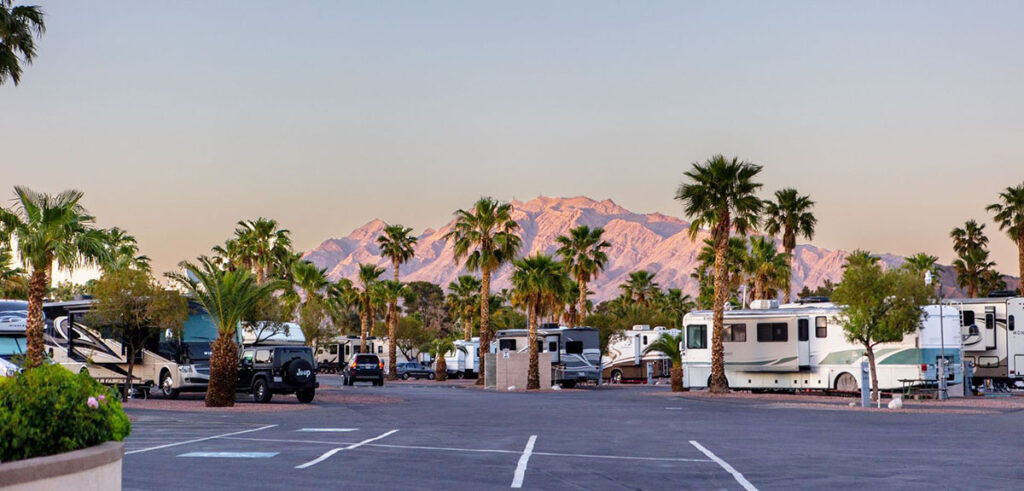RVs parked against a mountainous horizon.