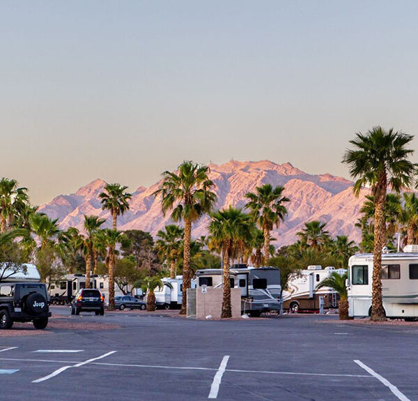 RVs parked against a mountainous horizon.
